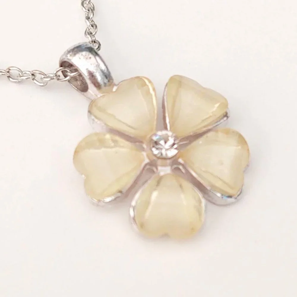Cream flower pendant necklace with cz center and silver accents
